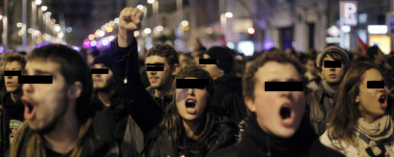 Protesters shout slogans during a general strike in Madrid, Spain, Wednesday, Nov. 14, 2012.